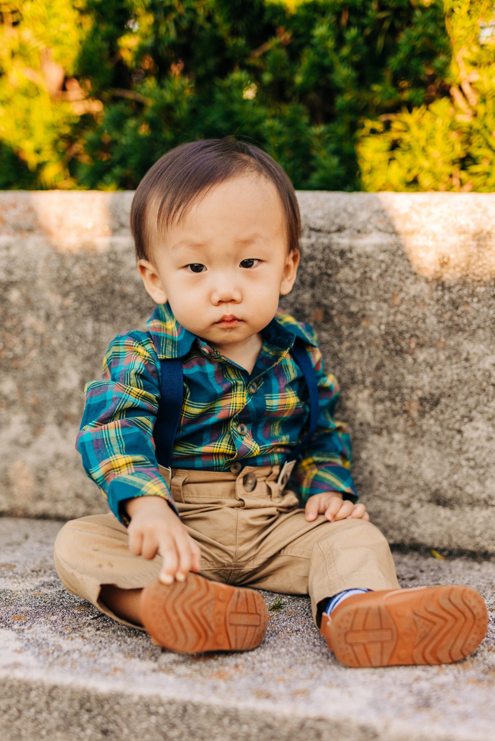small Asian boy in suspenders at River Farm in Alexandria, VA
