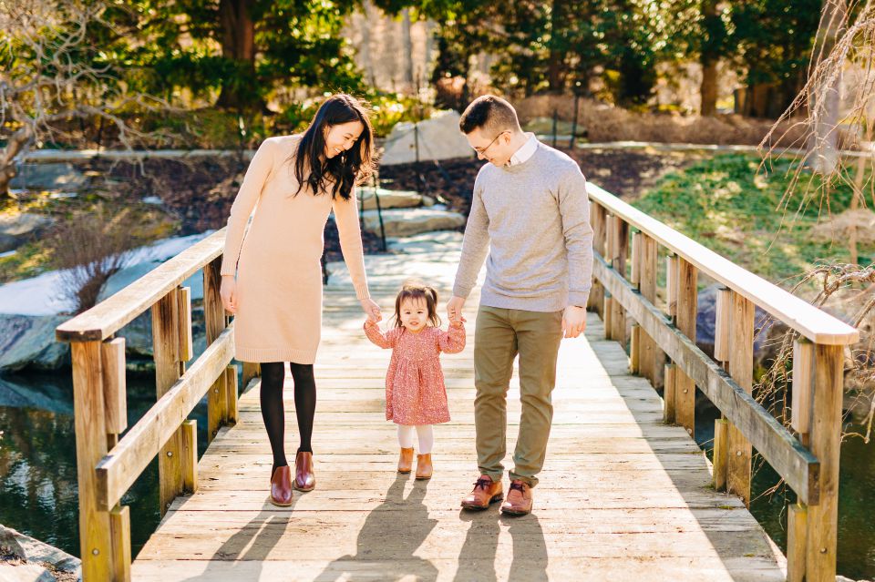 Young family walking along bridge at Brookside Gardens in Wheaton, MD