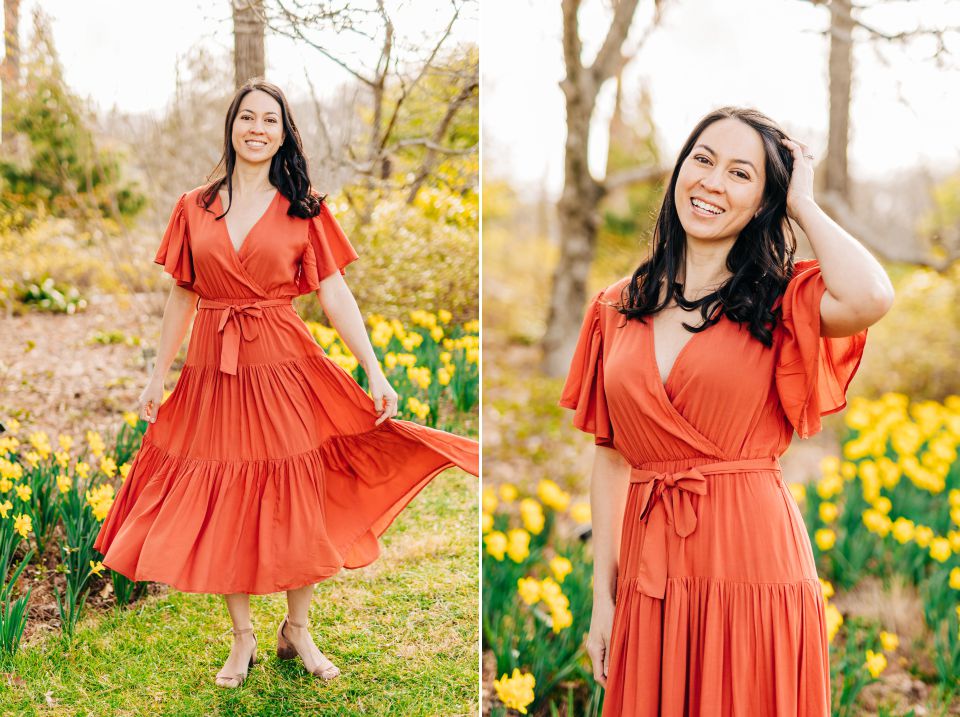 young woman wearing a orange dress in a daffodil field at Brookside Gardens in Wheaton, MD