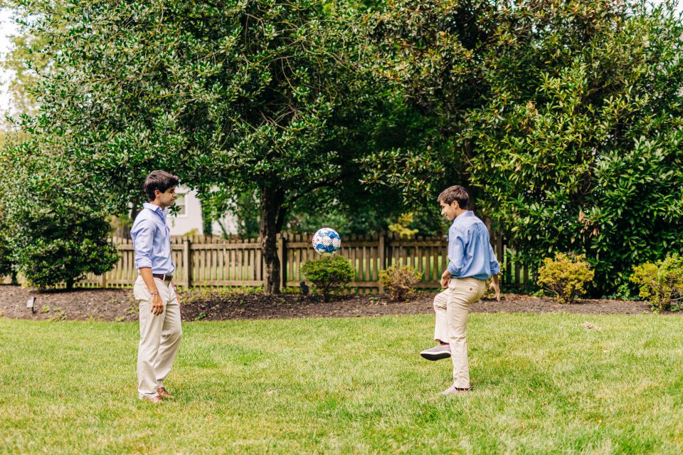 Two teenage boys kicking around a soccer ball in Vienna, VA