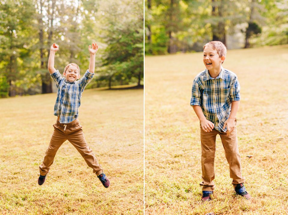 Young boy in plaid shirt laughing and jumping in his front yard in Haymarket, VA