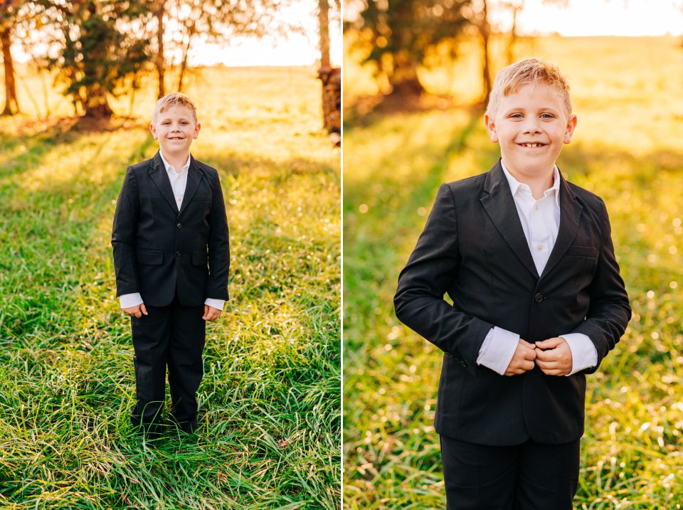 Young boy in suit posing for family photos at Manassas Battlefield Park