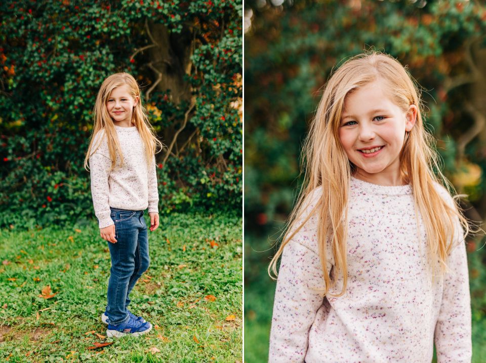 Young blonde girl in pink sweater posing for photos at Green Spring Gardens in Alexandria, VA