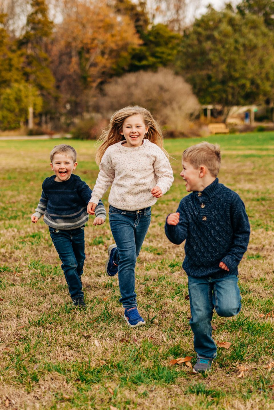 Three kids running through field in Alexandria, VA