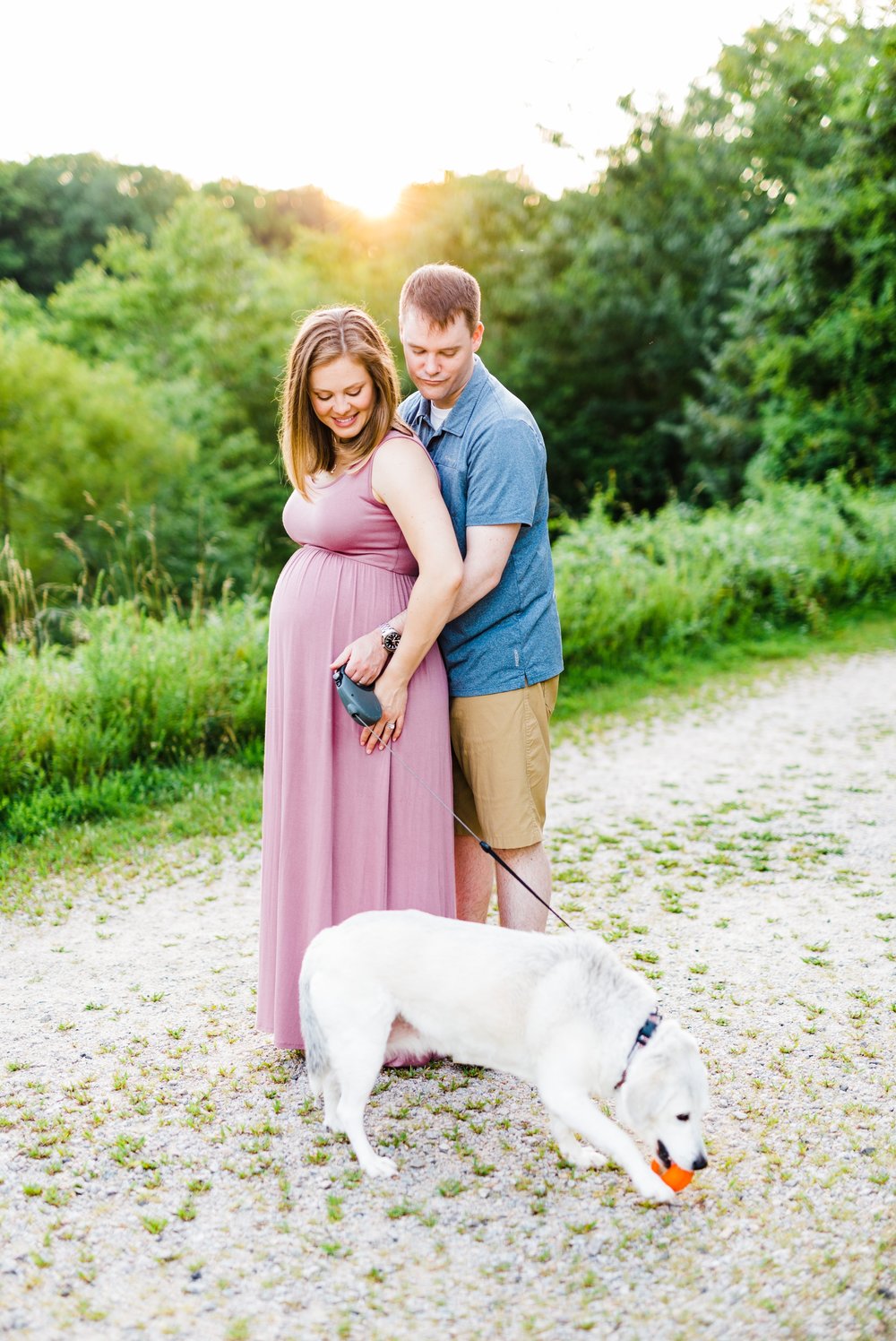 Couple posing for a maternity session at Lake Mercer in Springfield, VA