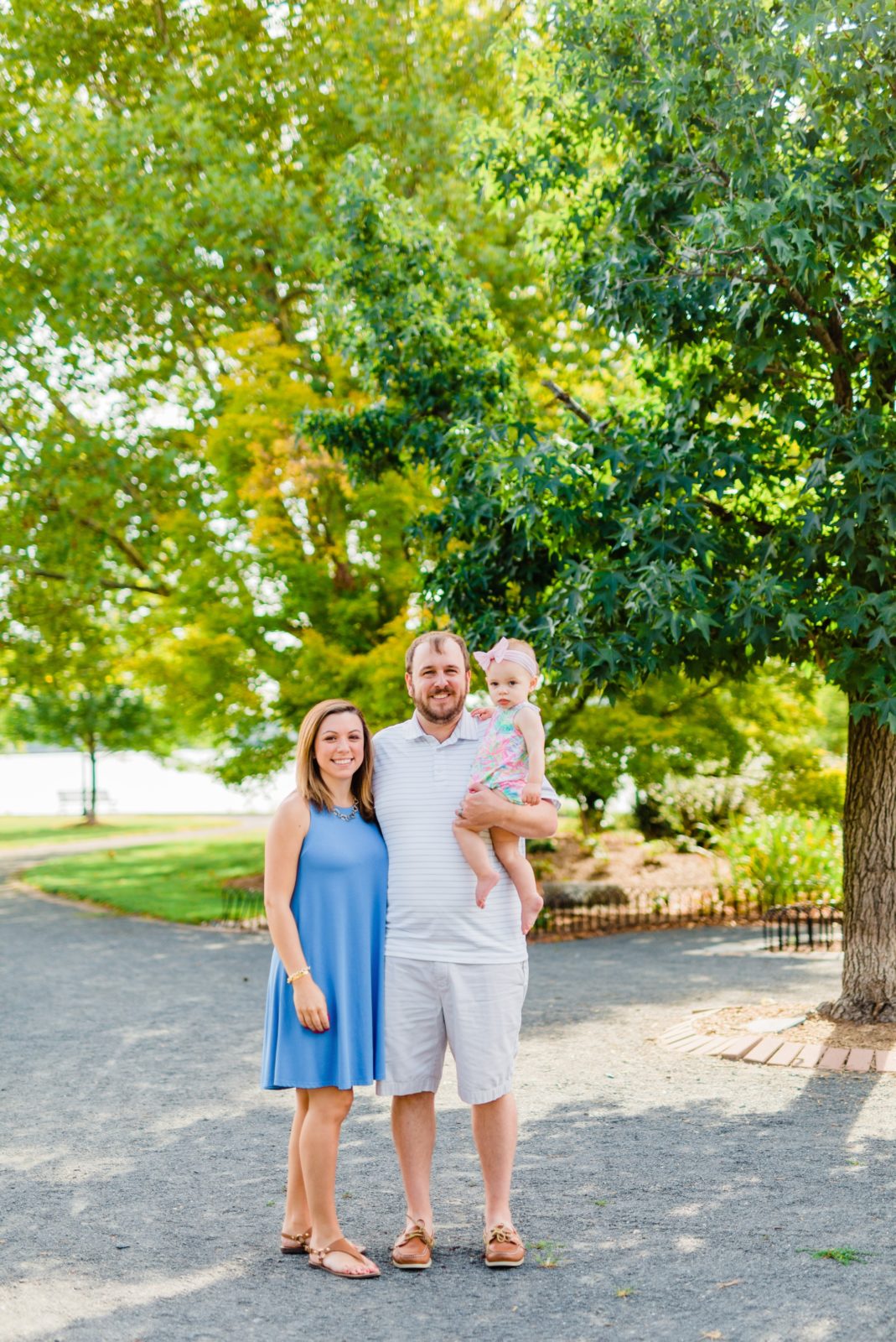 Family posing for family photo at Founders Park in Alexandria, VA