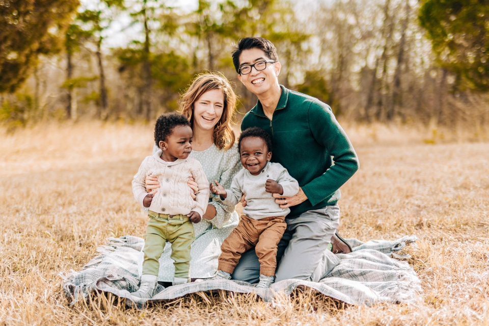 mixed-race family posing in a field in Manassas National Battlefield Park in Manassas, VA