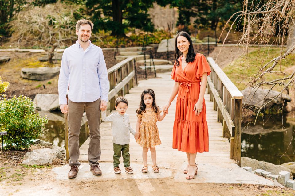 family poses for a photo session at Brookside Gardens in Wheaton, MD