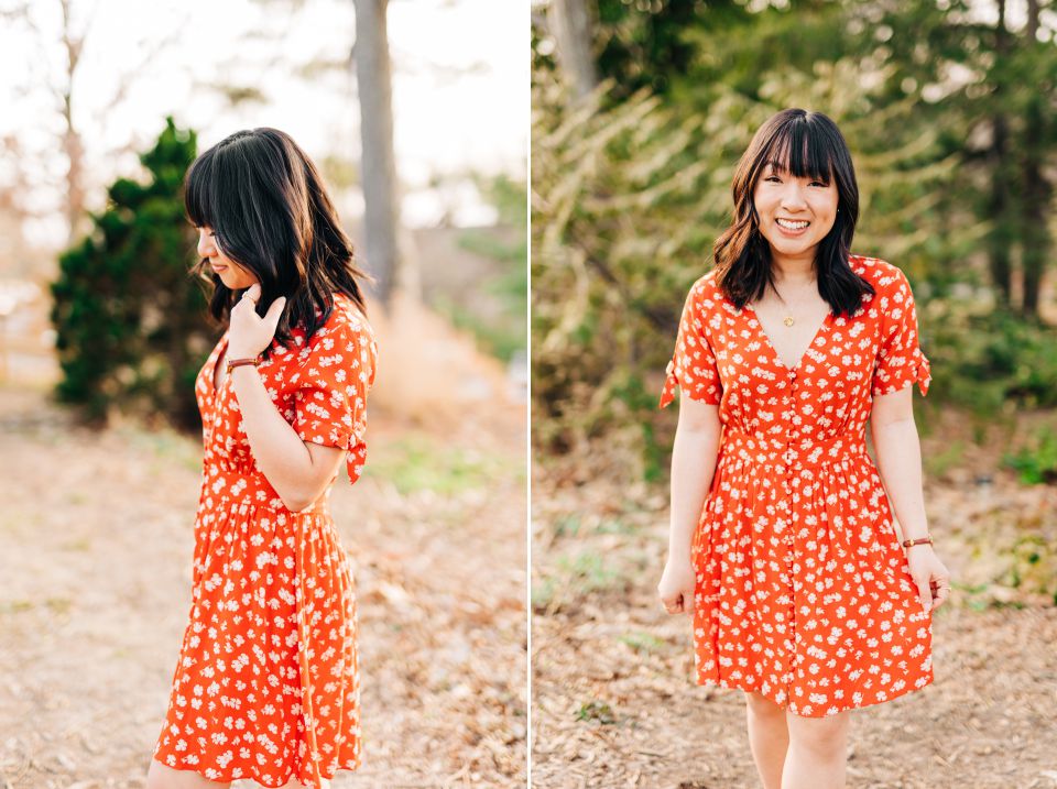 smiling woman in a red-orange floral dress