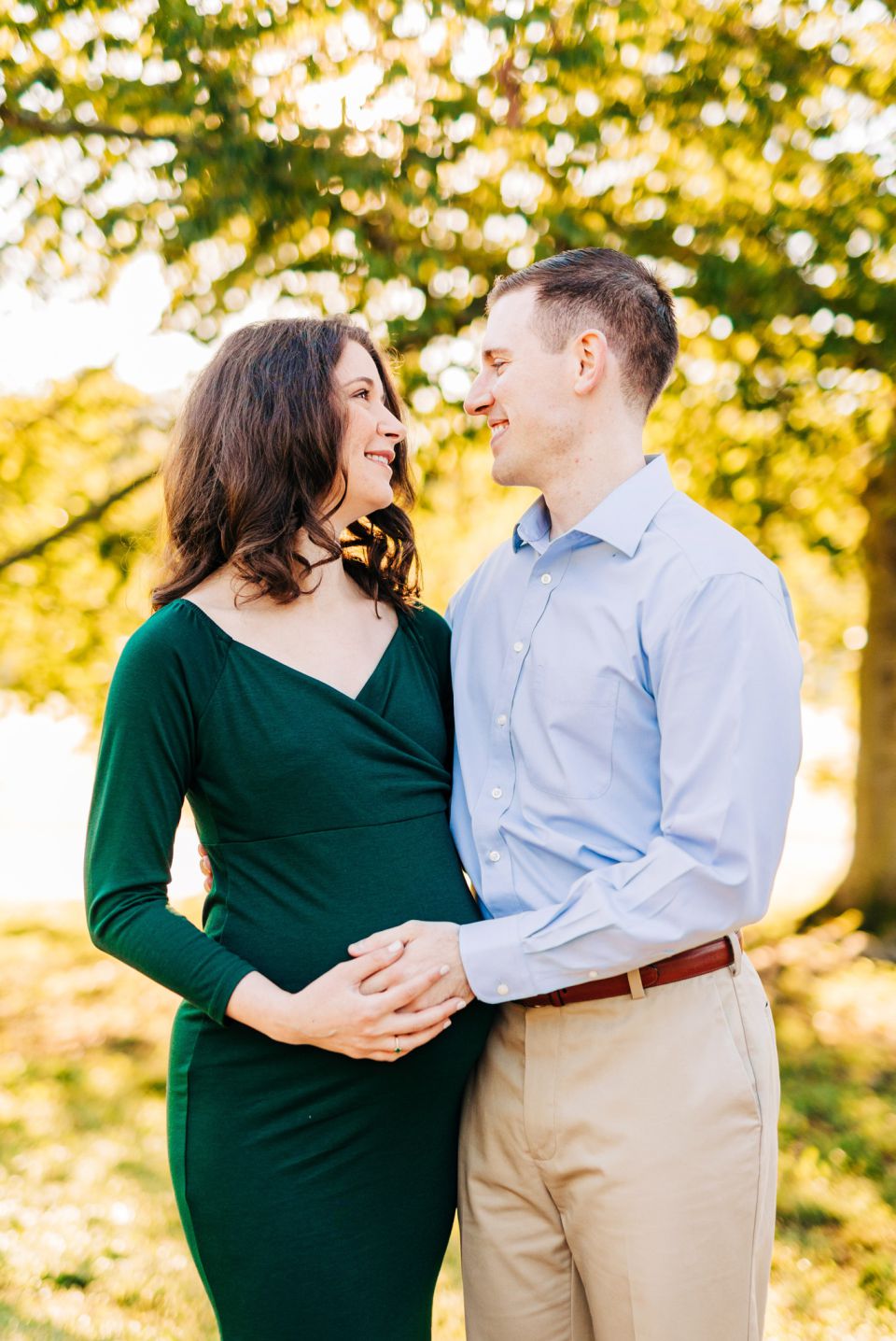 Young couple posing for maternity portraits at Green Spring Gardens in Alexandria, VA