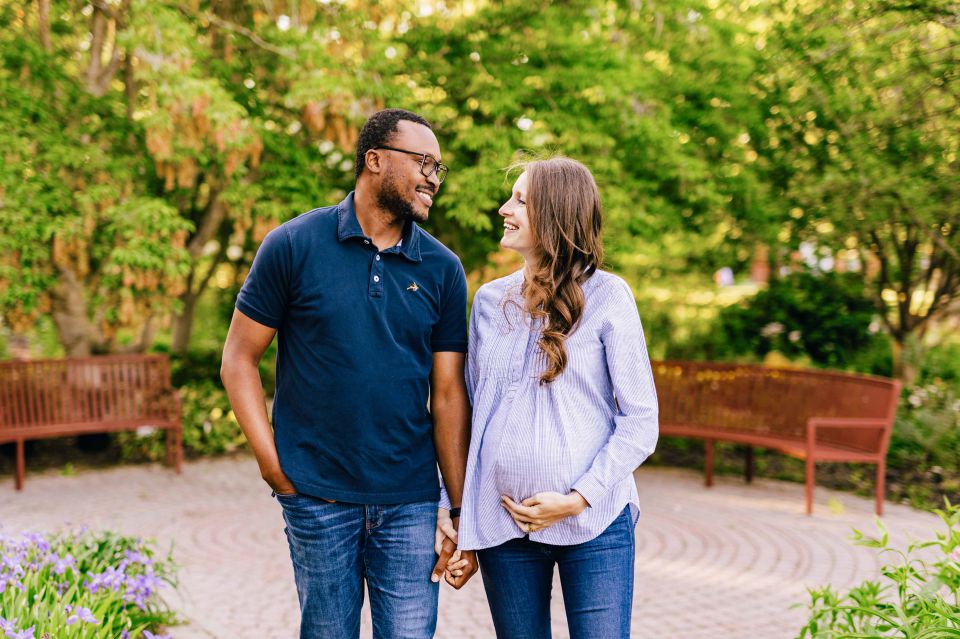 Couple posing for maternity photos at Green Spring Gardens in Alexandria, VA