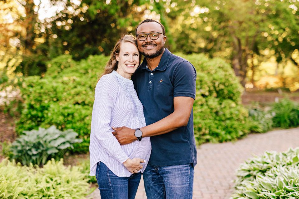 Couple posing for maternity photos at Green Spring Gardens in Alexandria, VA